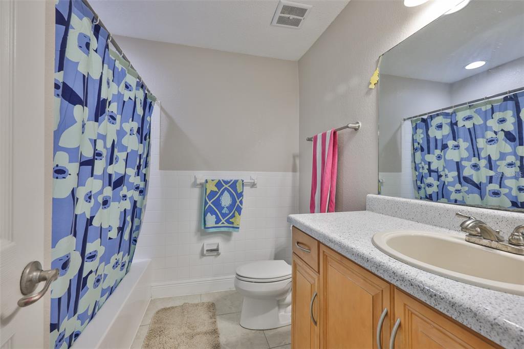 13125 Wilcox Road, Unit 16202 Largo, FL 33774 - Photo 17 of 37 a bathroom with a sink a toilet and a mirror