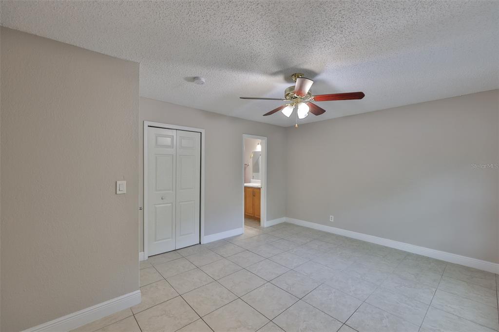 13125 Wilcox Road, Unit 16202 Largo, FL 33774 - Photo 22 of 37 a view of an empty room with chandelier fan