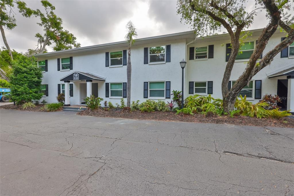 13125 Wilcox Road, Unit 16202 Largo, FL 33774 - Photo 27 of 37 front view of a house with a street