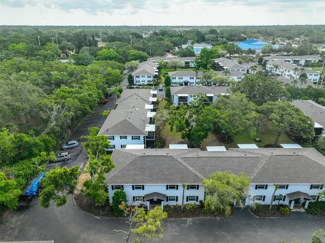 an aerial view of a house with a garden and plants