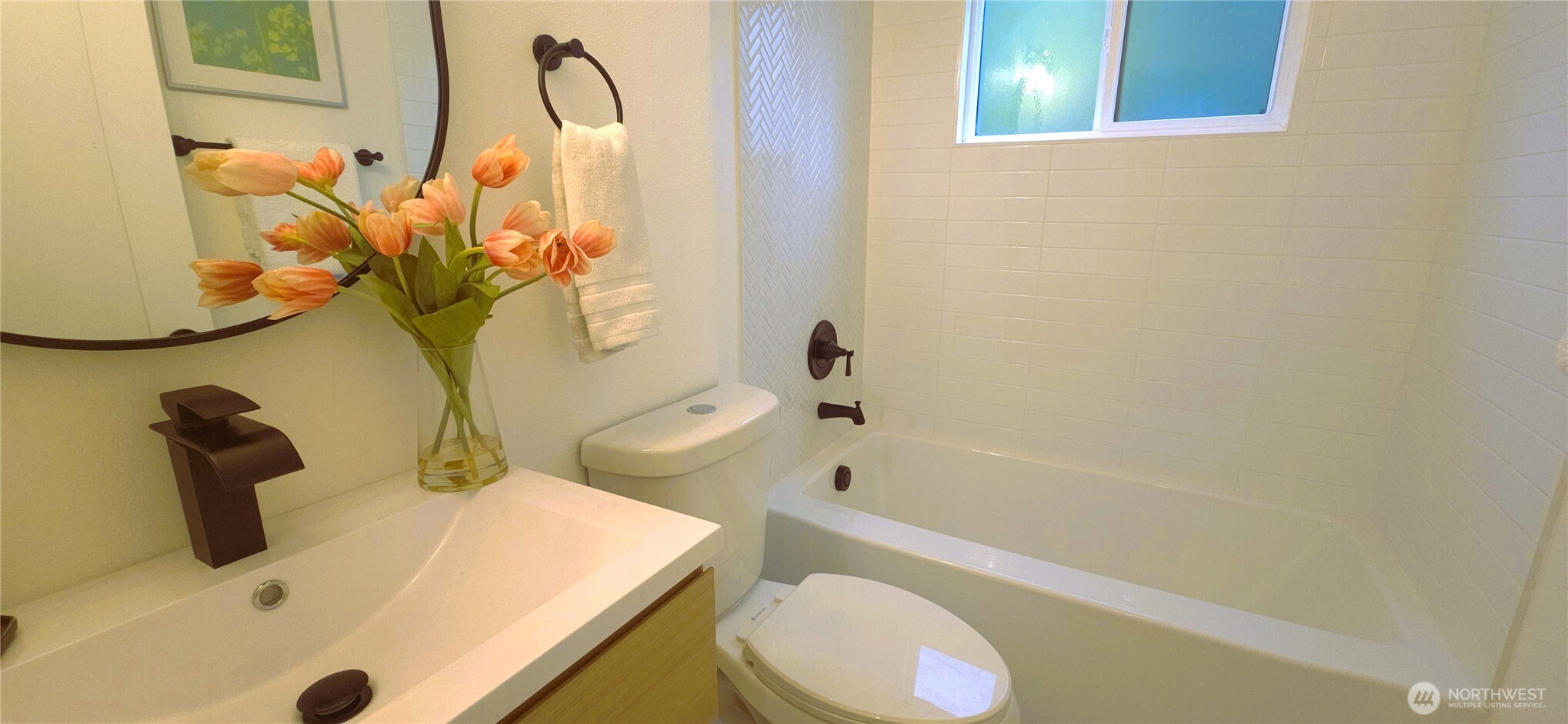 8421 39th Avenue Southwest Seattle, WA 98136 - Photo 9 of 24 a bathroom with a sink a toilet and bathtub