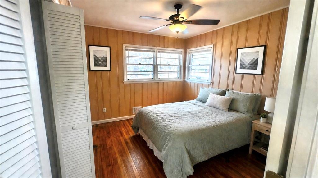 119 Fifth Avenue Jonesboro, GA 30236 - Photo 8 of 29 a bedroom with a large bed chandelier and a window