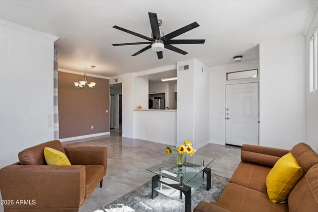 a living room with furniture and a rug