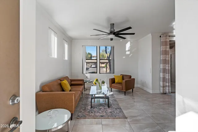 a living room with furniture and a window