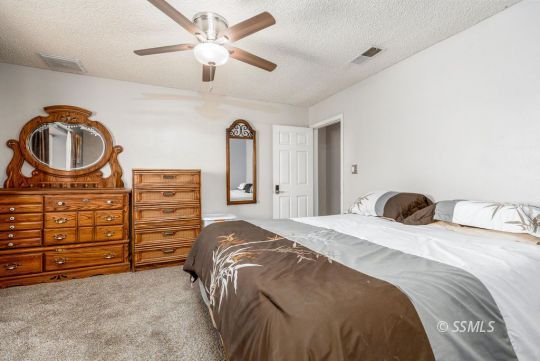 1004 Conejo Avenue Ridgecrest, CA 93555 - Photo 16 of 33 a bedroom with a bed and a closet