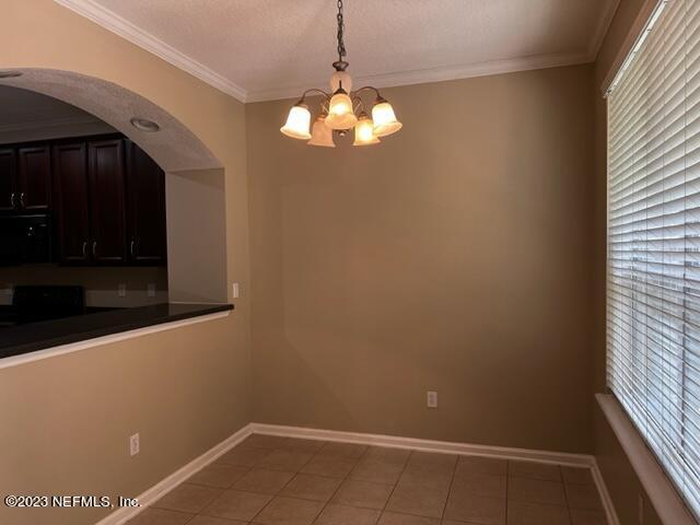 3121 East Banister Road St. Augustine, FL 32092 - Photo 11 of 31 a view of an empty room with a window