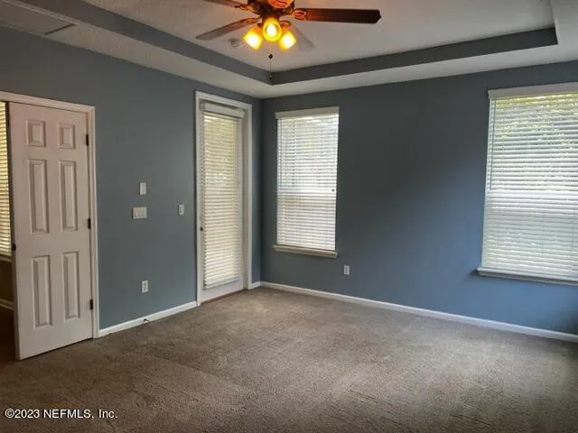 a bathroom with a glass door shower