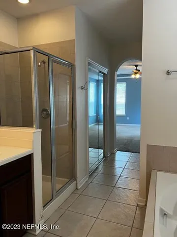 a bathroom with a double vanity sink and mirror