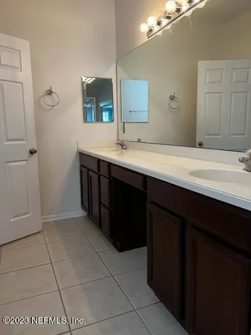 a bath tub sitting in a bathroom next to a window