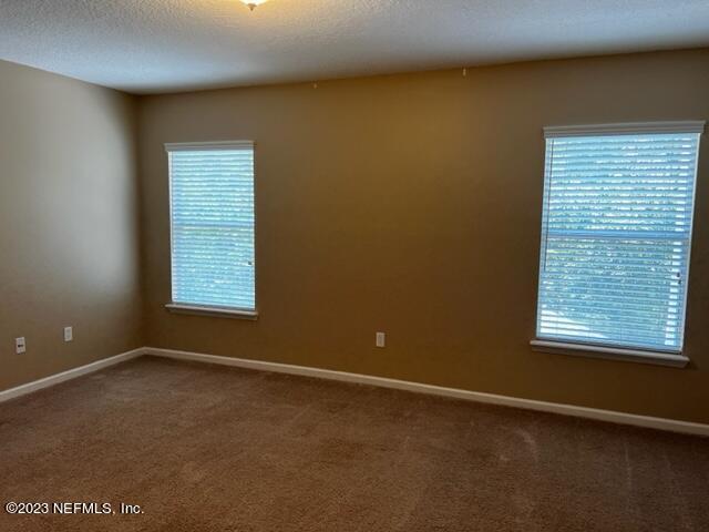 3121 East Banister Road St. Augustine, FL 32092 - Photo 25 of 31 an empty room with a window