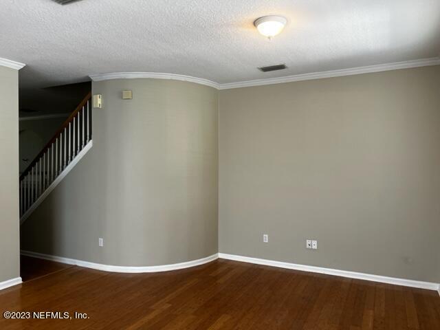 3121 East Banister Road St. Augustine, FL 32092 - Photo 4 of 31 a view of an empty room with wooden floor