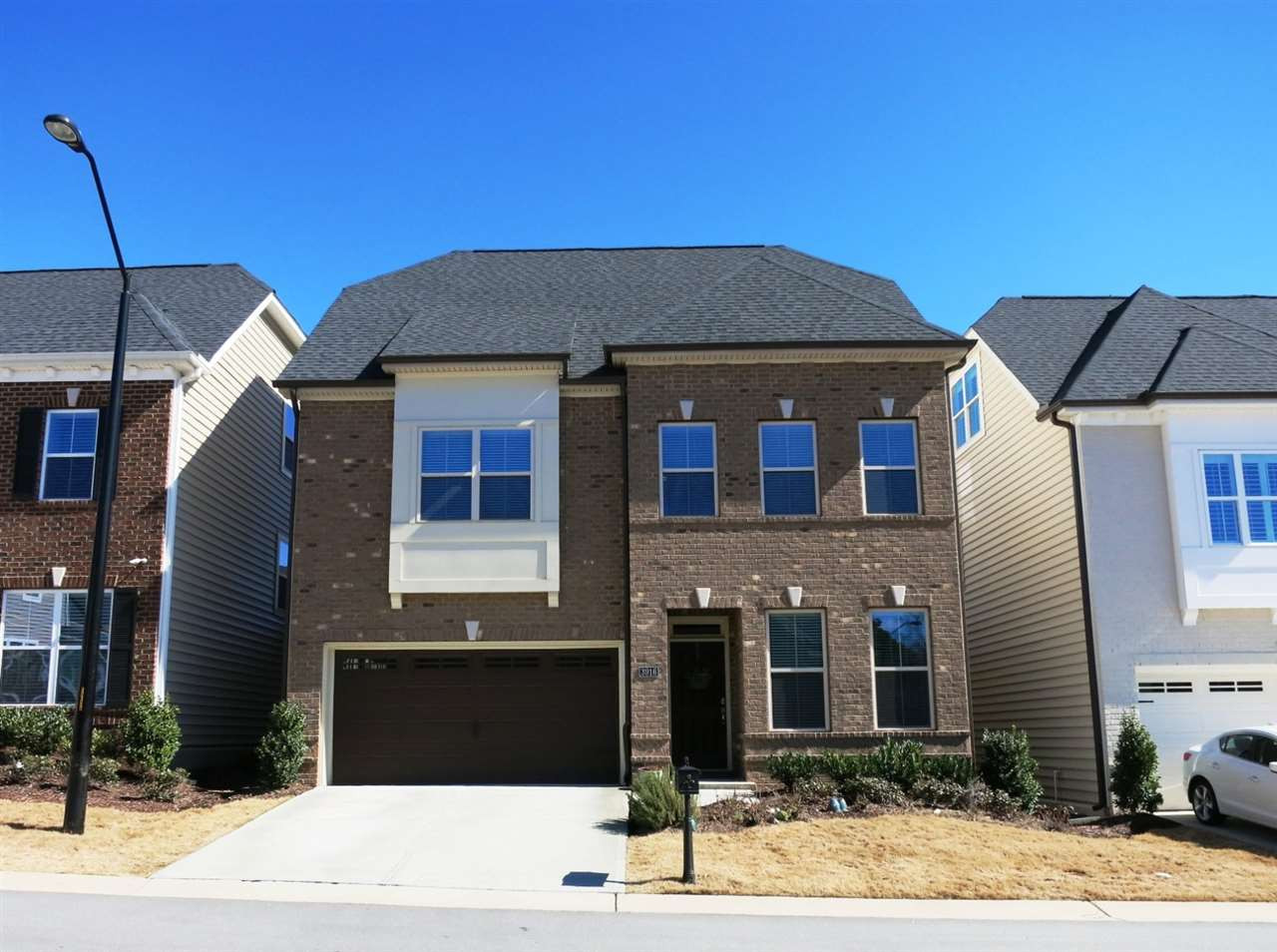 3916 Rock Rose Lane Raleigh, NC 27612 - Photo 1 of 25 Newer upscale 3-story TH in prime NW Raleigh location near Crabtree Valley & North Hills Malls/REX Hospital/I-40 & 440! Semi-attached (only at Storage Rms), so it lives like a detached home! HOA covers exterior & yard maintenance! Exterior Front