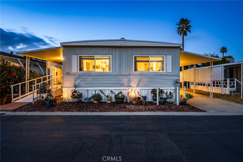 1120 East Mission Road, Unit 79 Fallbrook, CA 92028 - Photo 1 of 43 a view of a house with a patio