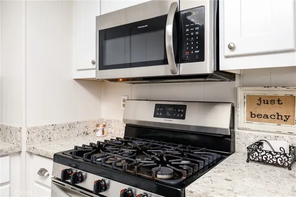 a kitchen with a stove and a microwave