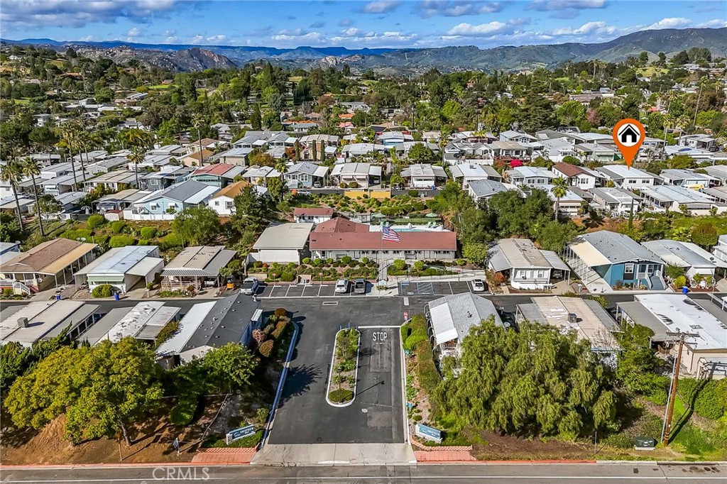 1120 East Mission Road, Unit 79 Fallbrook, CA 92028 - Photo 2 of 43 an aerial view of residential houses with outdoor space