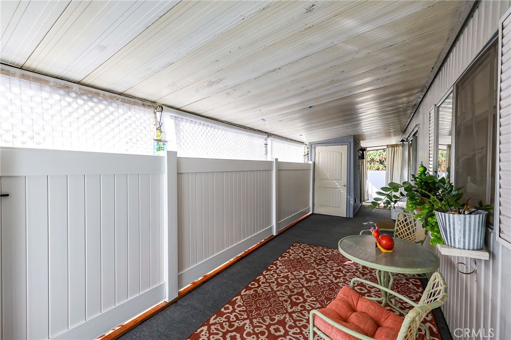 1120 East Mission Road, Unit 79 Fallbrook, CA 92028 - Photo 23 of 43 a room that has a plant and a rug