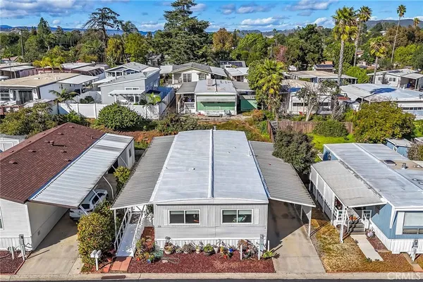 an aerial view of a house with a yard