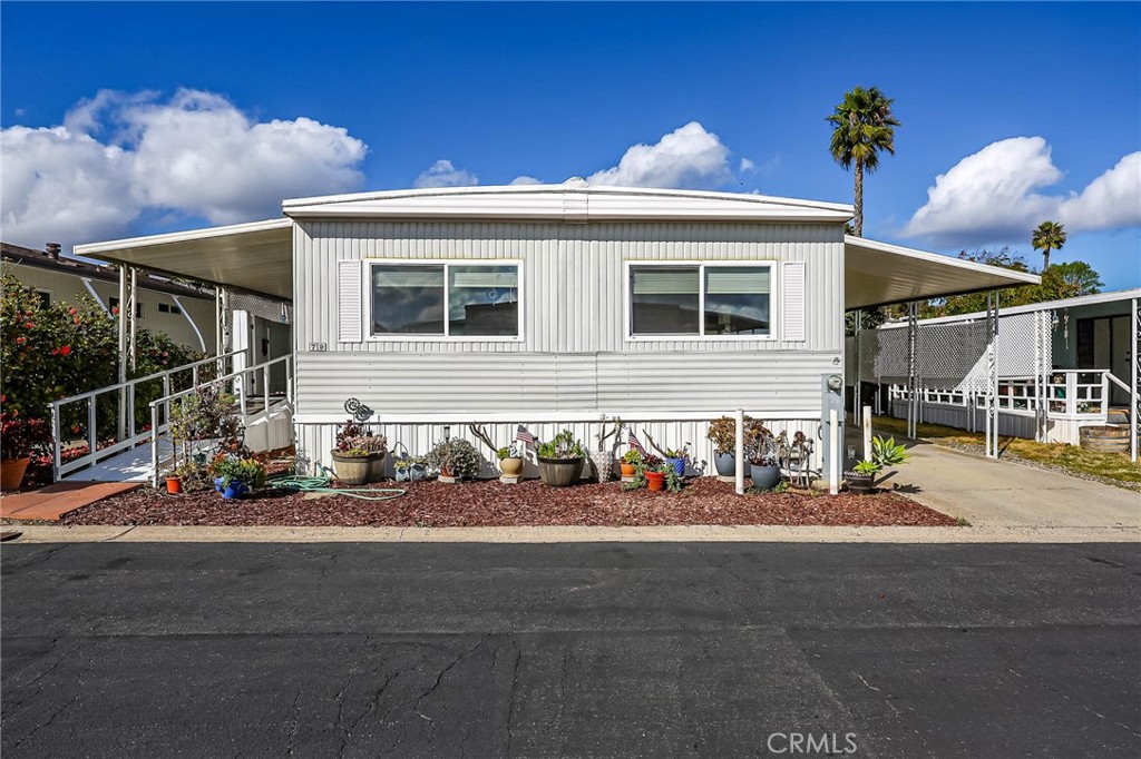 1120 East Mission Road, Unit 79 Fallbrook, CA 92028 - Photo 30 of 43 a front view of a house with street