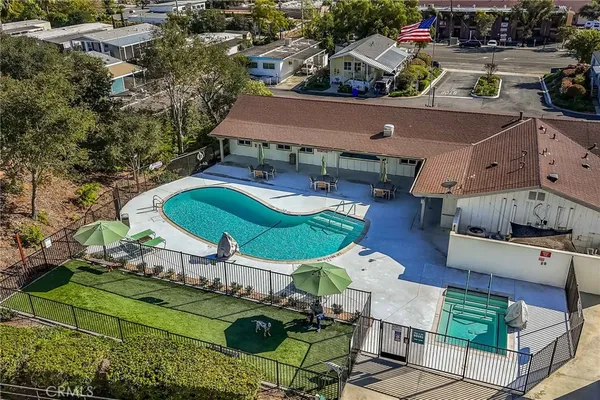 an aerial view of a house with garden space and street view