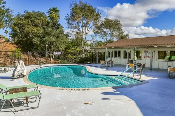 a view of a swimming pool with a patio