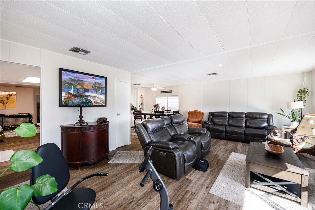 1120 East Mission Road, Unit 79 Fallbrook, CA 92028 - Photo 7 of 43 a living room with furniture and wooden floor