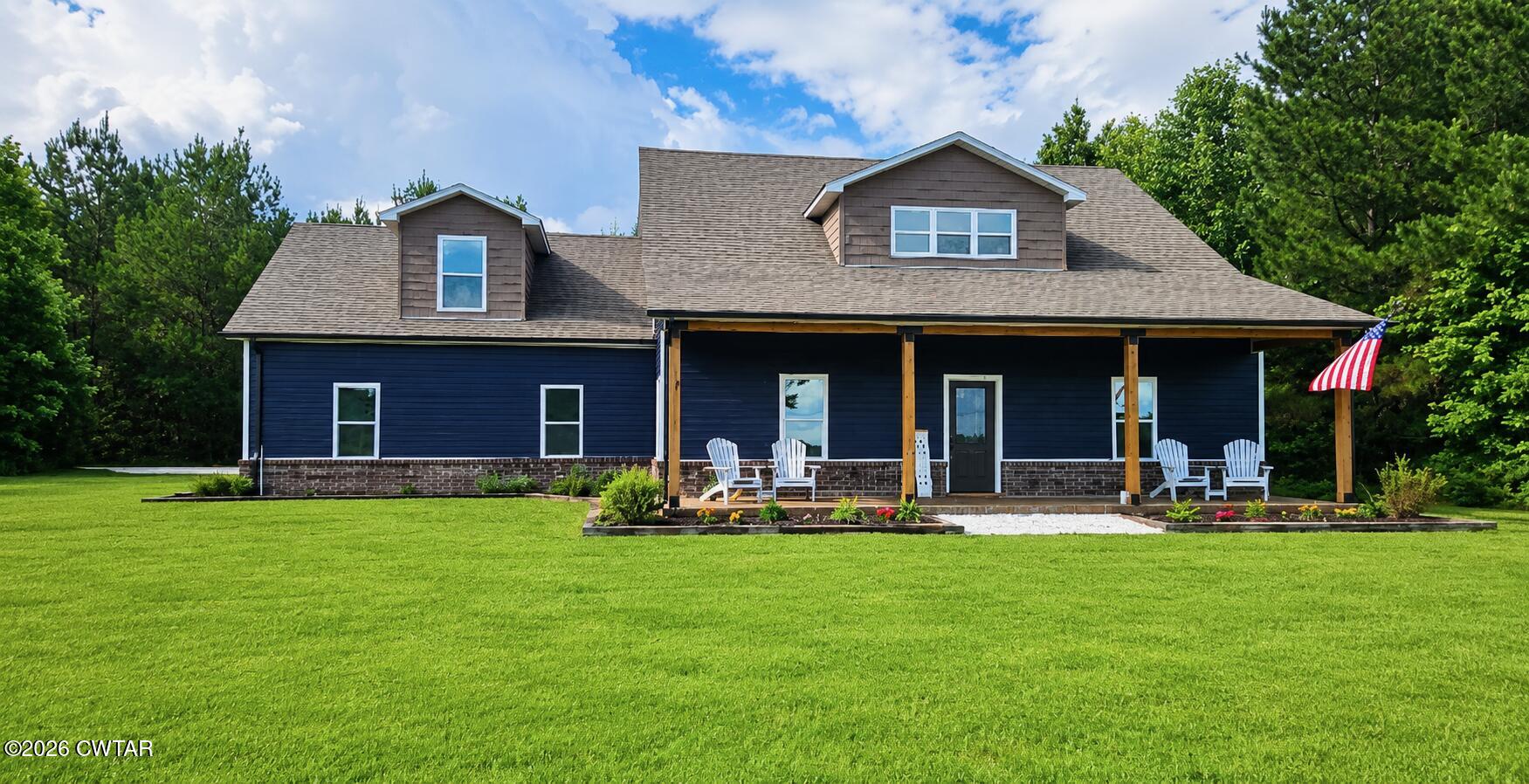 1586 Love Road Bells, TN 38006 - Photo 59 of 61 a front view of a house with a yard and trees