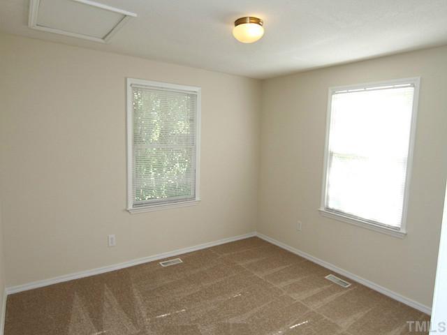 715 Edmund Street Raleigh, NC 27604 - Photo 4 of 13 an empty room with a window