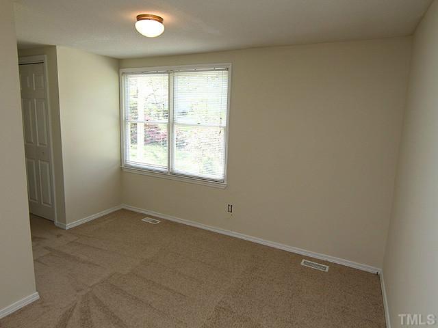 715 Edmund Street Raleigh, NC 27604 - Photo 7 of 13 an empty room with a window