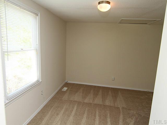715 Edmund Street Raleigh, NC 27604 - Photo 8 of 13 an empty room with a window