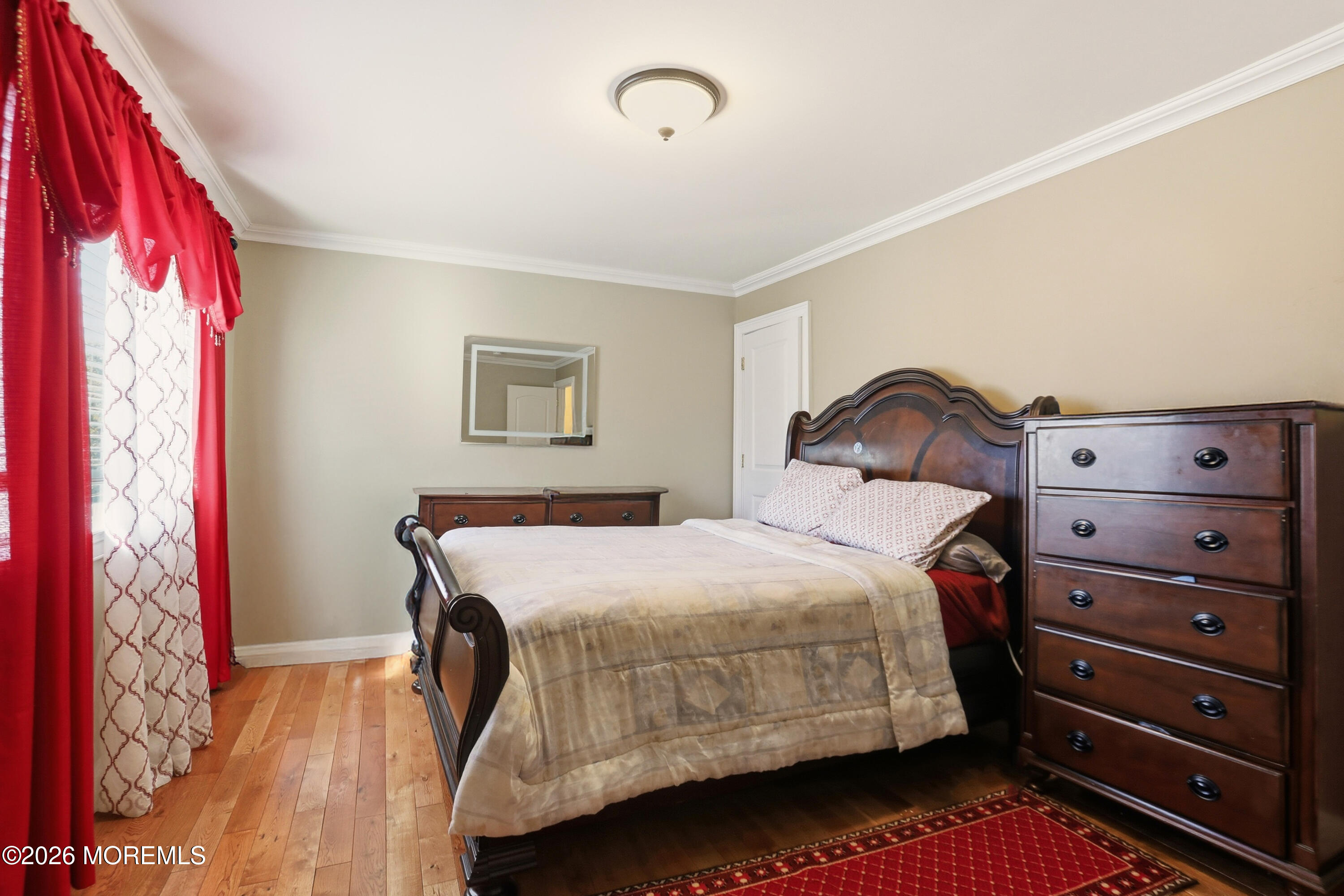 1991 Ridgeway Road Toms River, NJ 08757 - Photo 18 of 46 a bedroom with a bed and lamp with the wooden floor