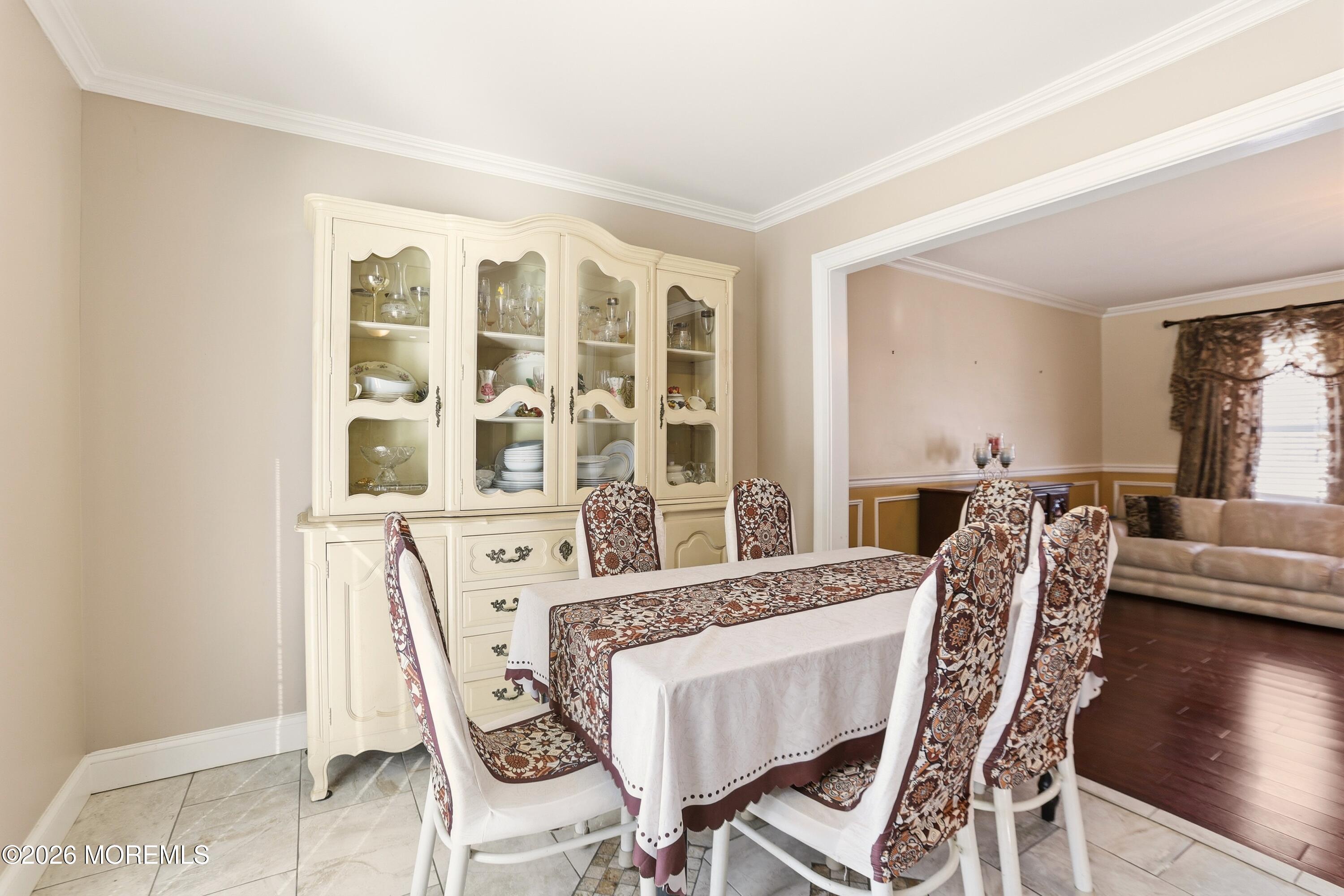 1991 Ridgeway Road Toms River, NJ 08757 - Photo 32 of 46 a view of a dining room with furniture and wooden floor