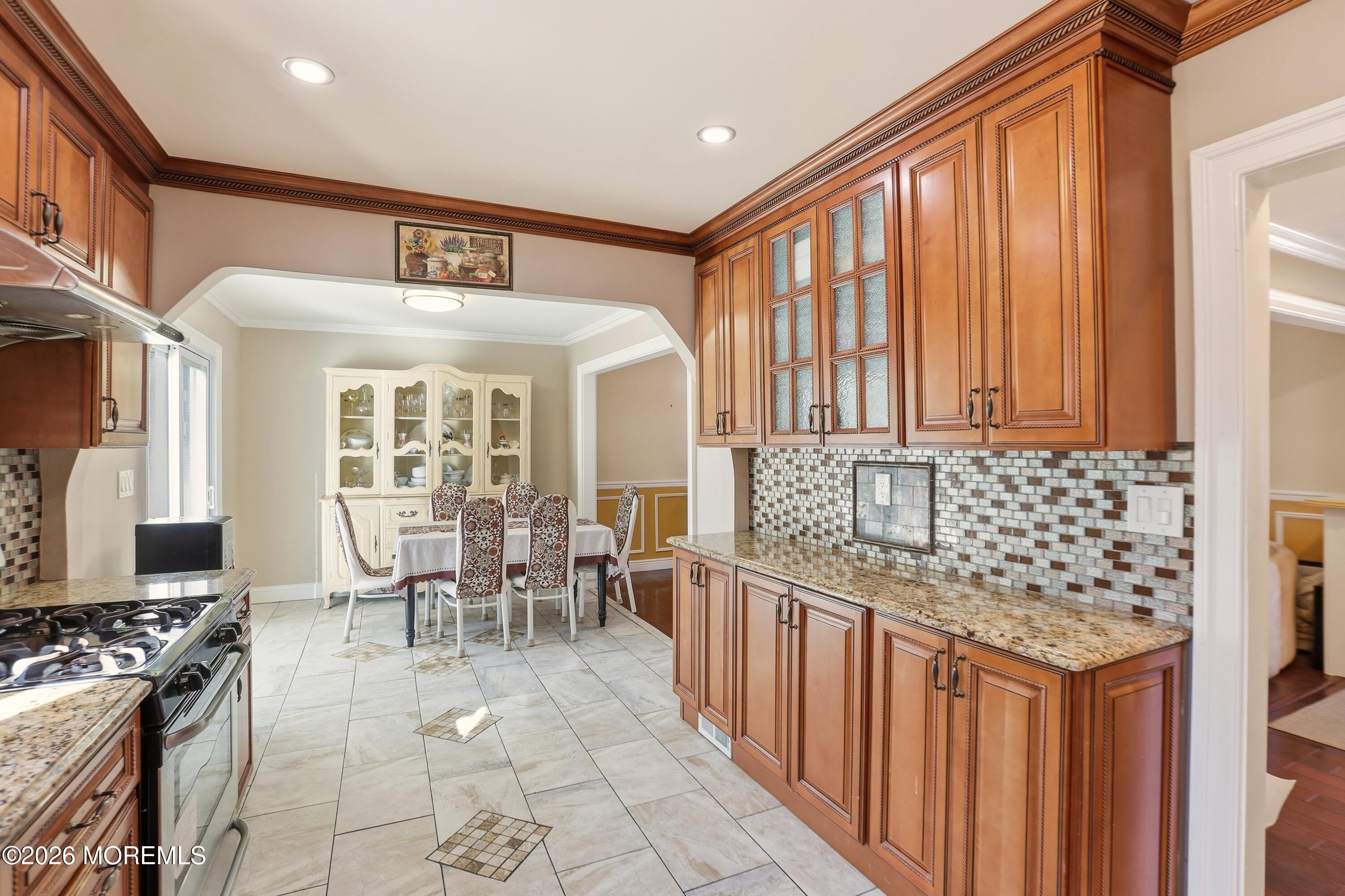 1991 Ridgeway Road Toms River, NJ 08757 - Photo 37 of 46 a dining hall with stainless steel appliances granite countertop a stove and a wooden cabinets