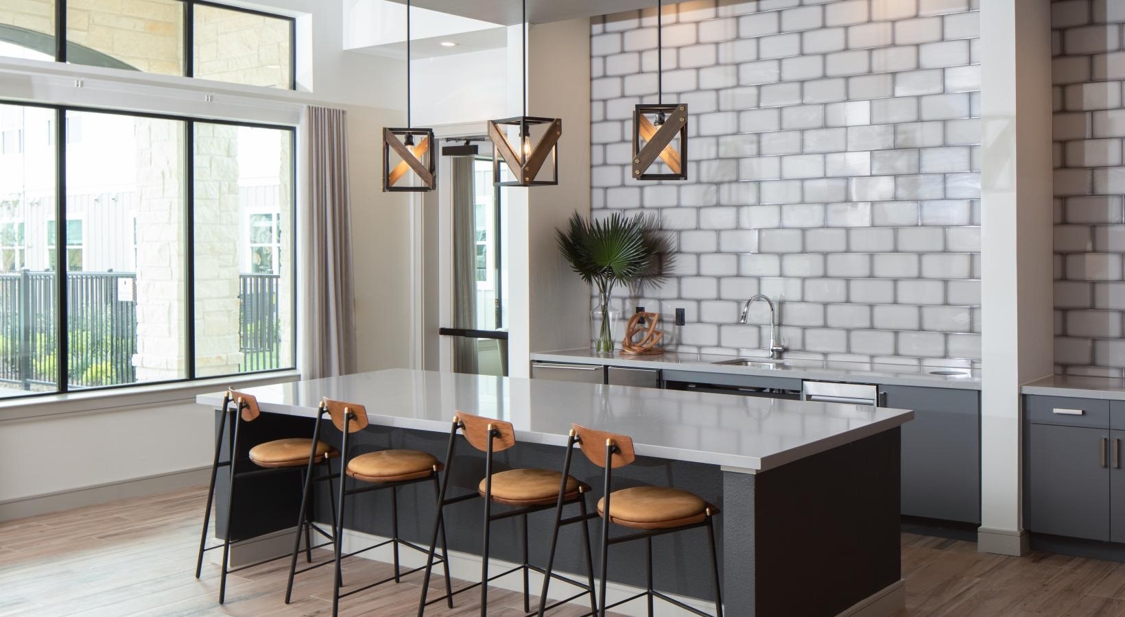12111 South Main Street, Unit 5303 Houston, TX 77035 - Photo 19 of 24 a kitchen with a sink and chairs