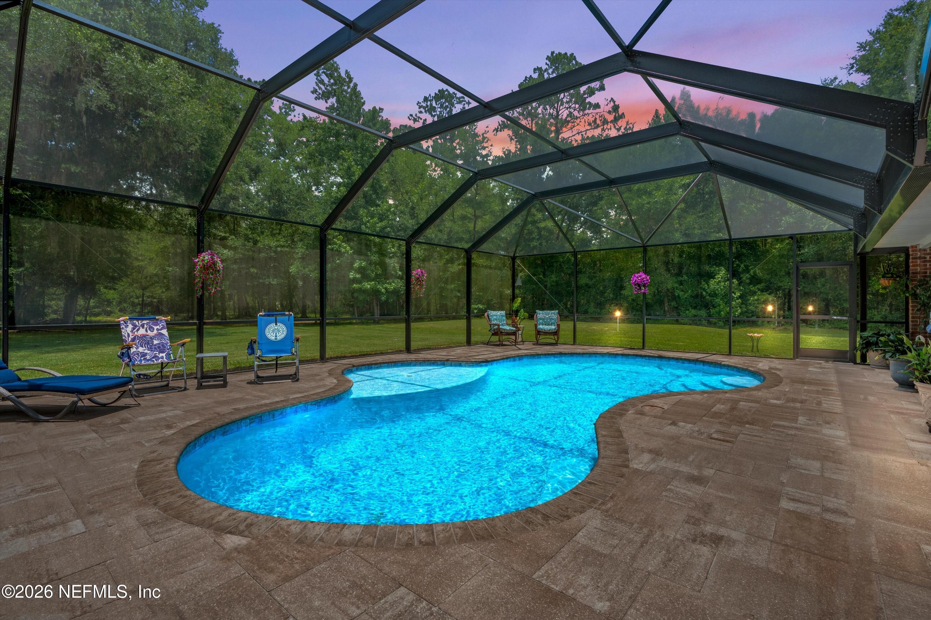 5566 Don Manuel Road Elkton, FL 32033 - Photo 37 of 47 a view of a swimming pool with a patio