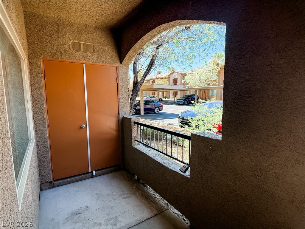 7701 West Robindale Road, Unit 110 Las Vegas, NV 89113 - Photo 17 of 21 A private entry patio offers convenient access to a covered parking area.