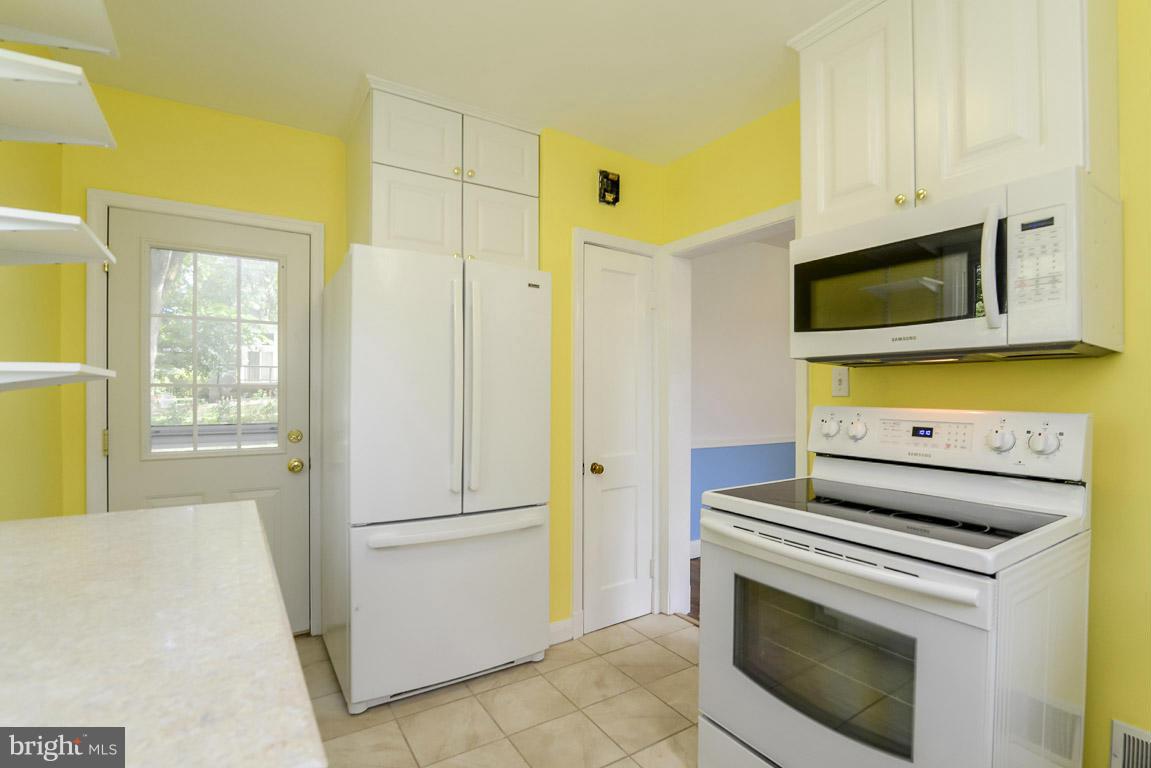 628 Round Oak Road Baltimore, MD 21204 - Photo 10 of 24 Kitchen exits to backyard porch