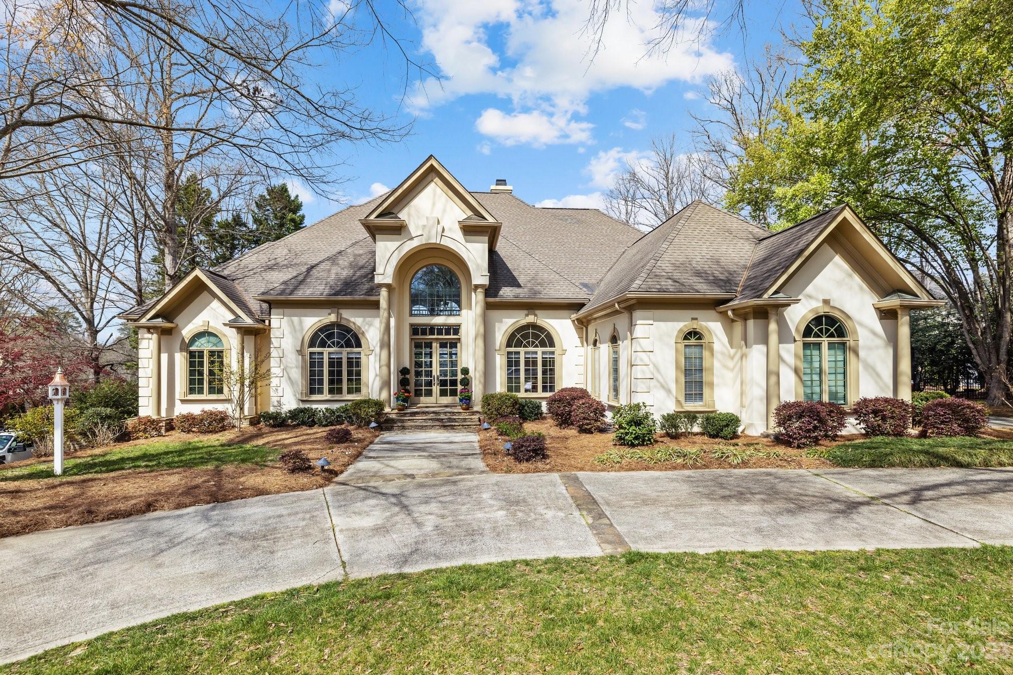 4732 Old Course Drive Charlotte, NC 28277 - Photo 1 of 48 a front view of a house with garden