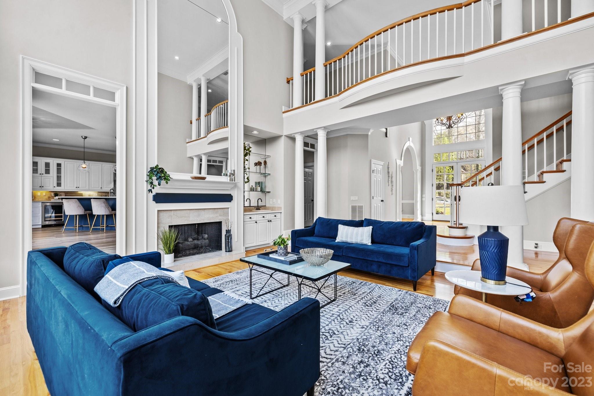 4732 Old Course Drive Charlotte, NC 28277 - Photo 12 of 48 a living room with furniture a fireplace and a chandelier