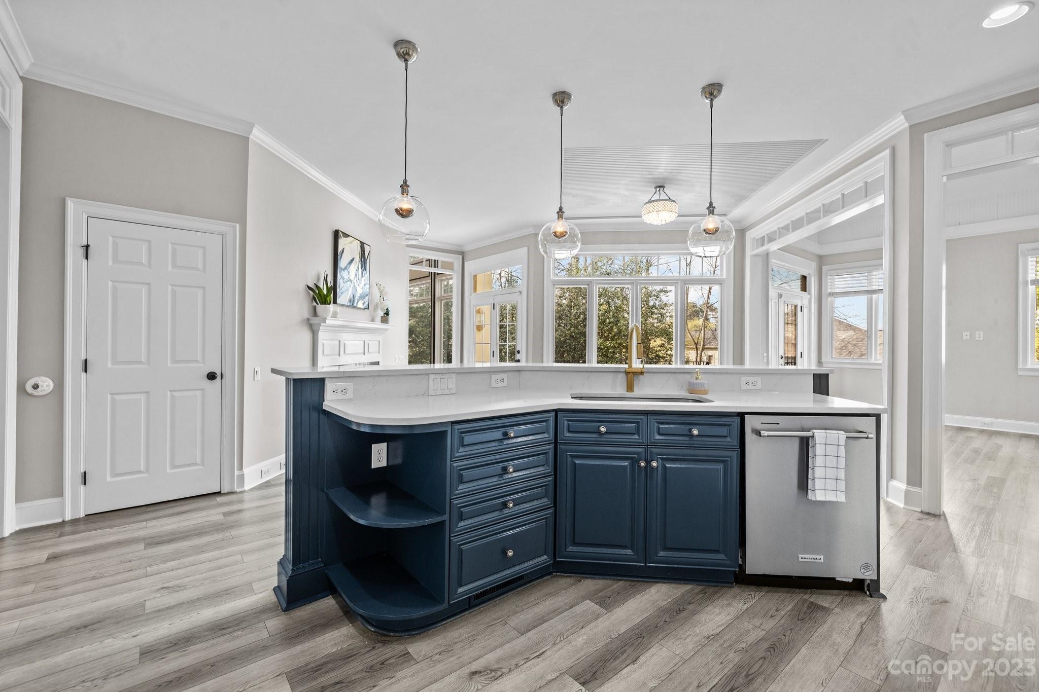 4732 Old Course Drive Charlotte, NC 28277 - Photo 20 of 48 a kitchen with stainless steel appliances granite countertop wooden floors and white cabinets