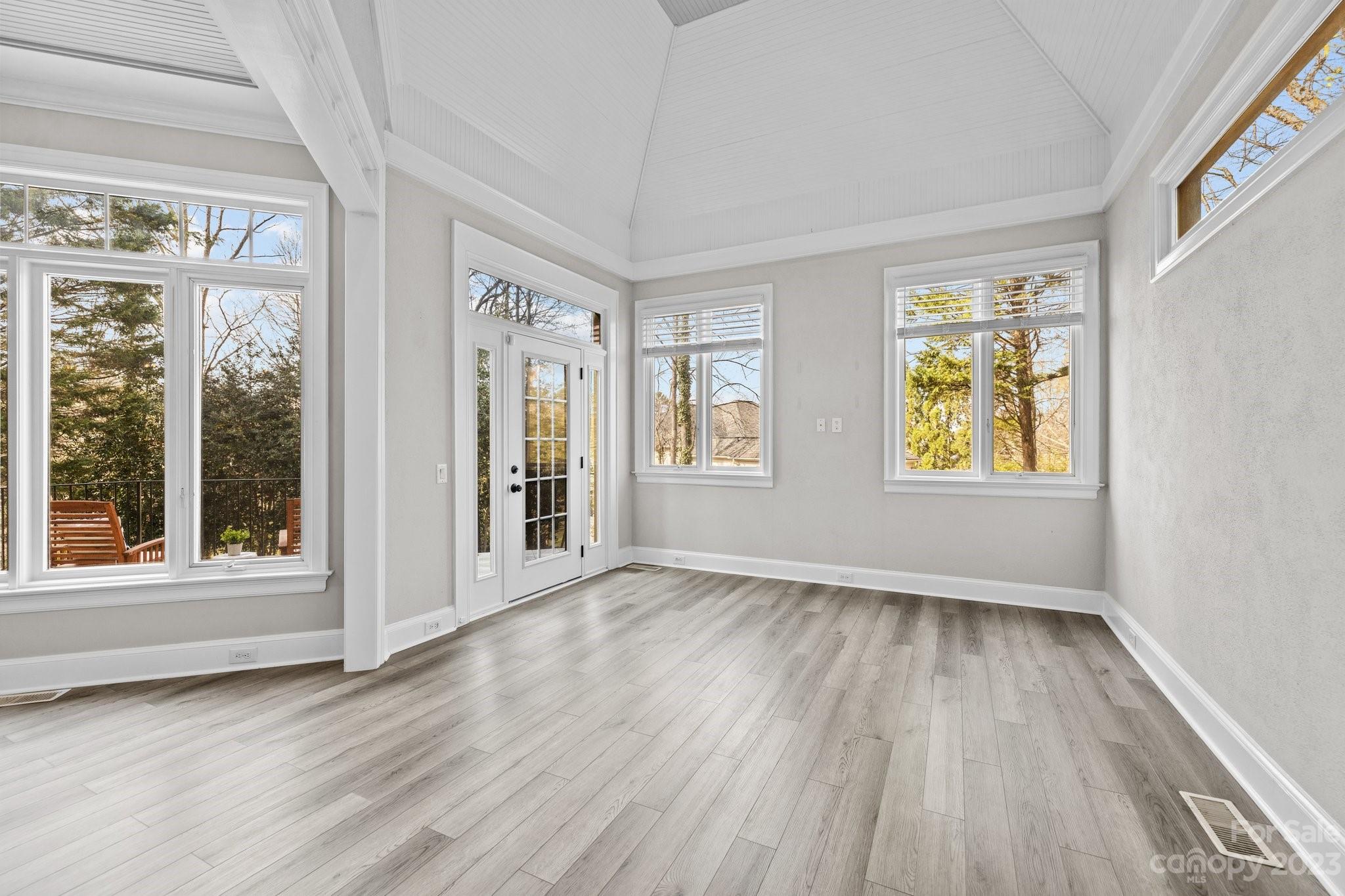 4732 Old Course Drive Charlotte, NC 28277 - Photo 23 of 48 a view of an empty room with wooden floor and a window