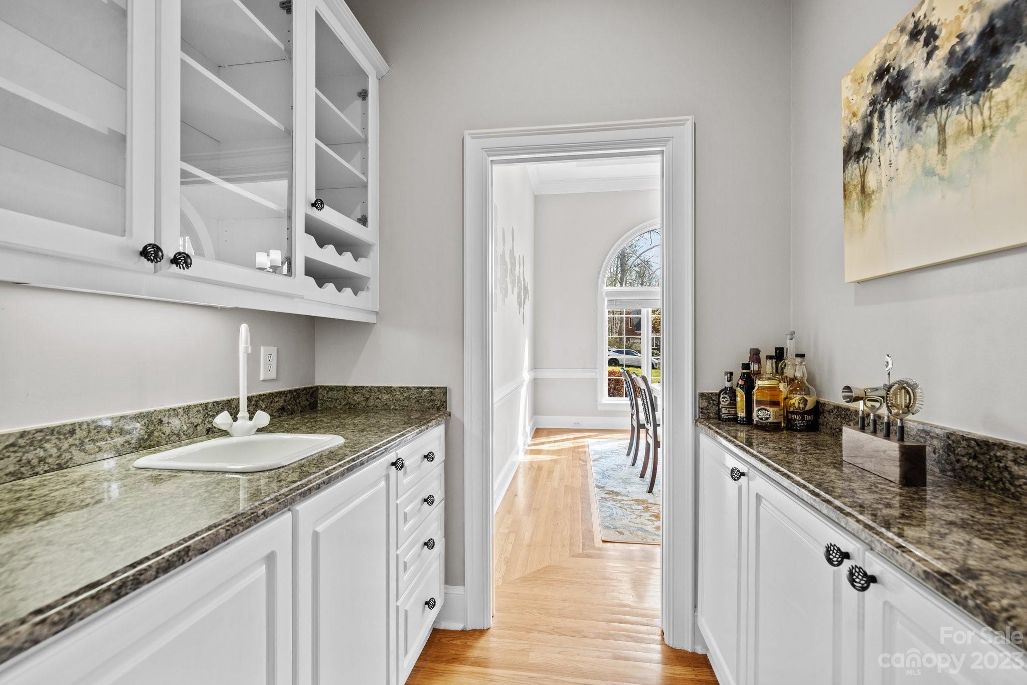 4732 Old Course Drive Charlotte, NC 28277 - Photo 25 of 48 a kitchen with granite countertop a sink and cabinets