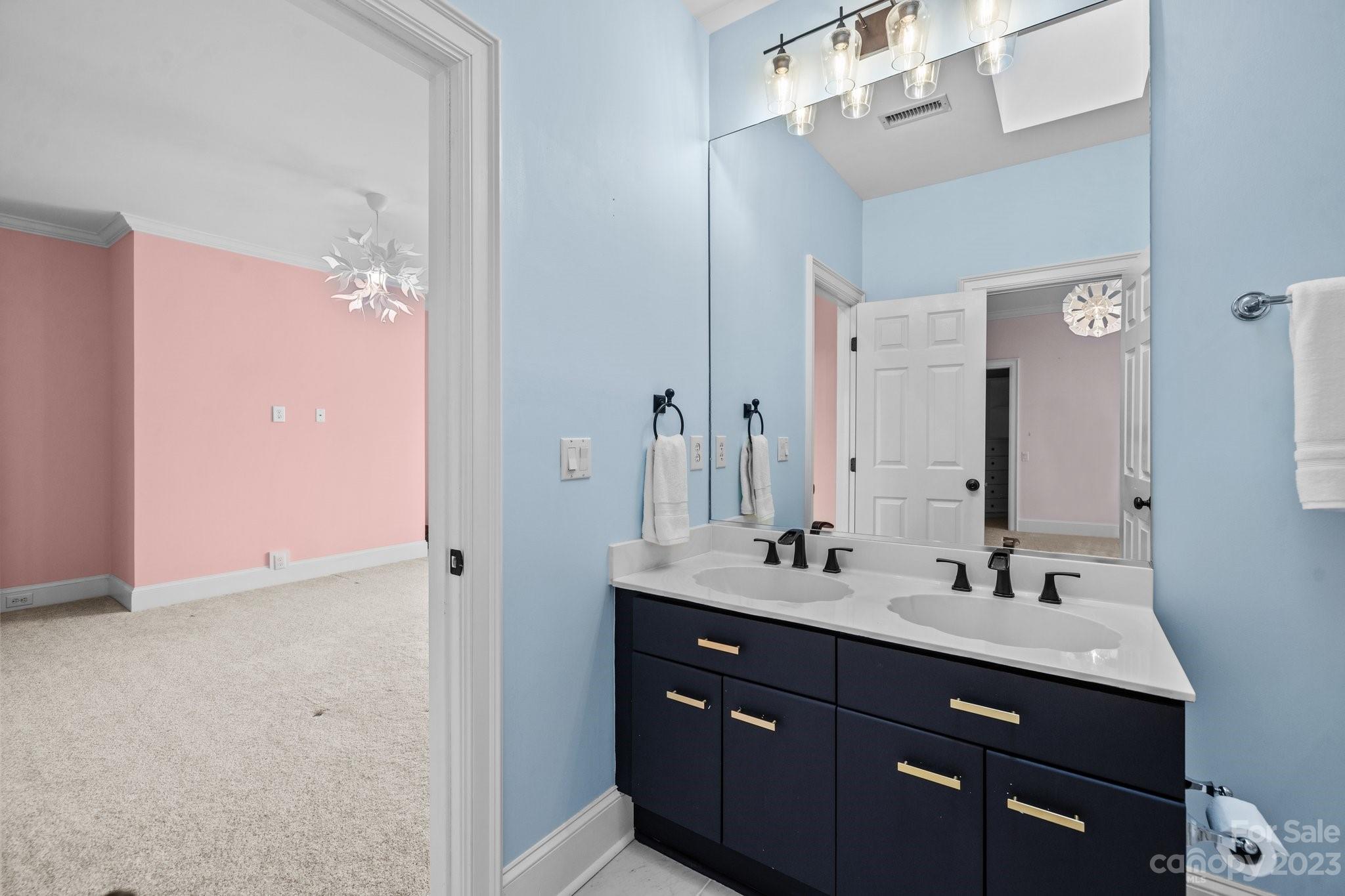 4732 Old Course Drive Charlotte, NC 28277 - Photo 34 of 48 a bathroom with a sink vanity and mirror