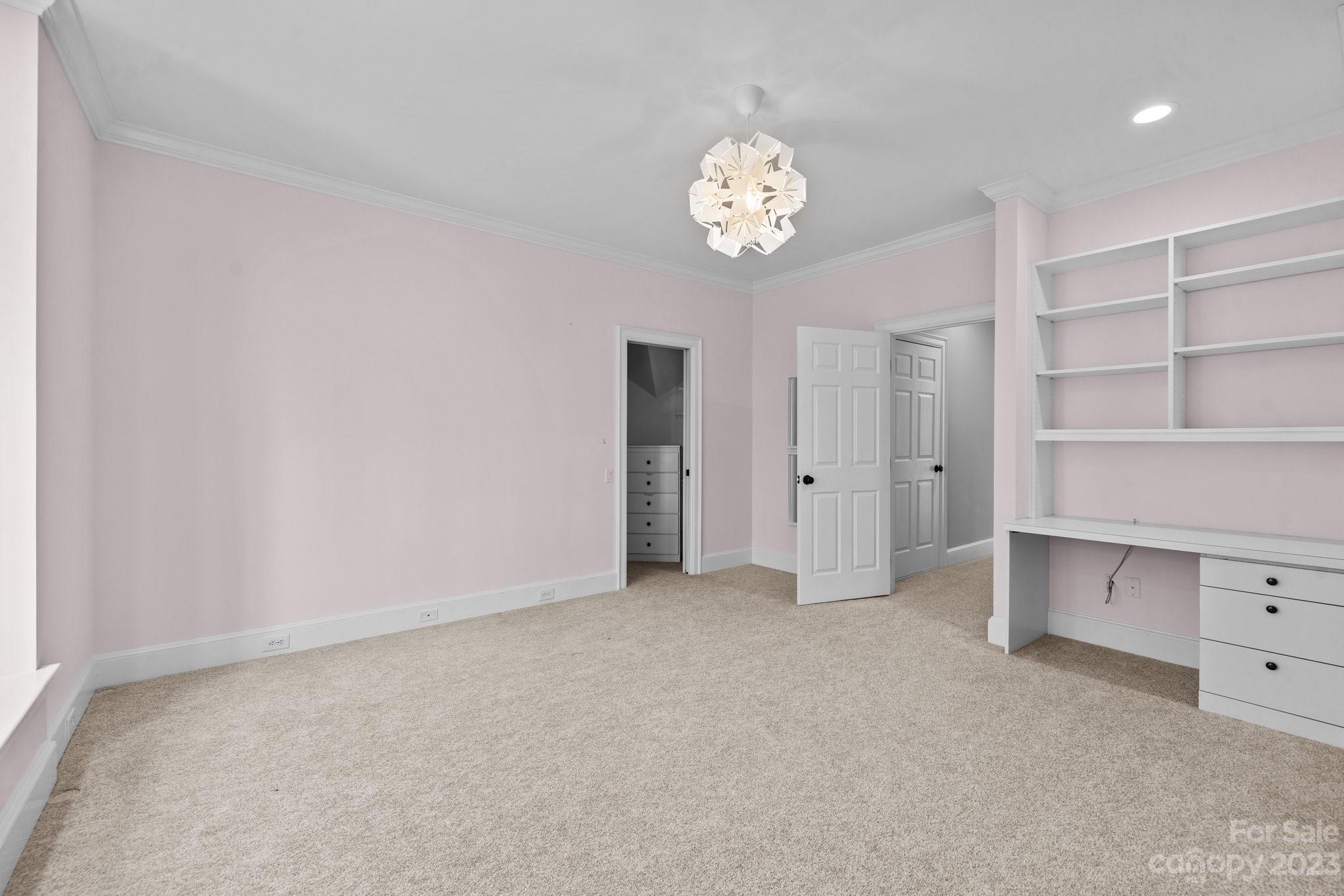 4732 Old Course Drive Charlotte, NC 28277 - Photo 35 of 48 an empty room with a cabinet and a lamp