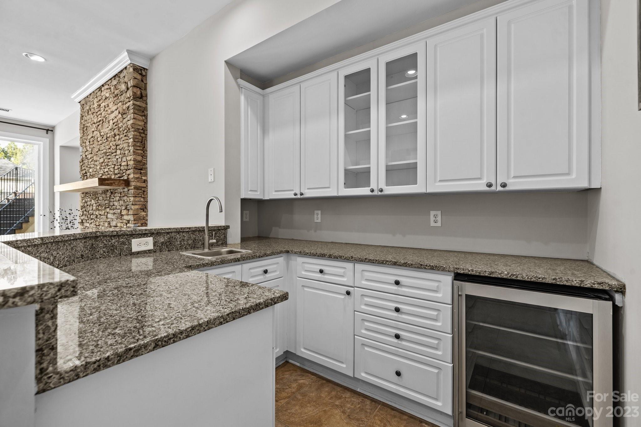 4732 Old Course Drive Charlotte, NC 28277 - Photo 37 of 48 a kitchen with granite countertop a sink stainless steel appliances and cabinets