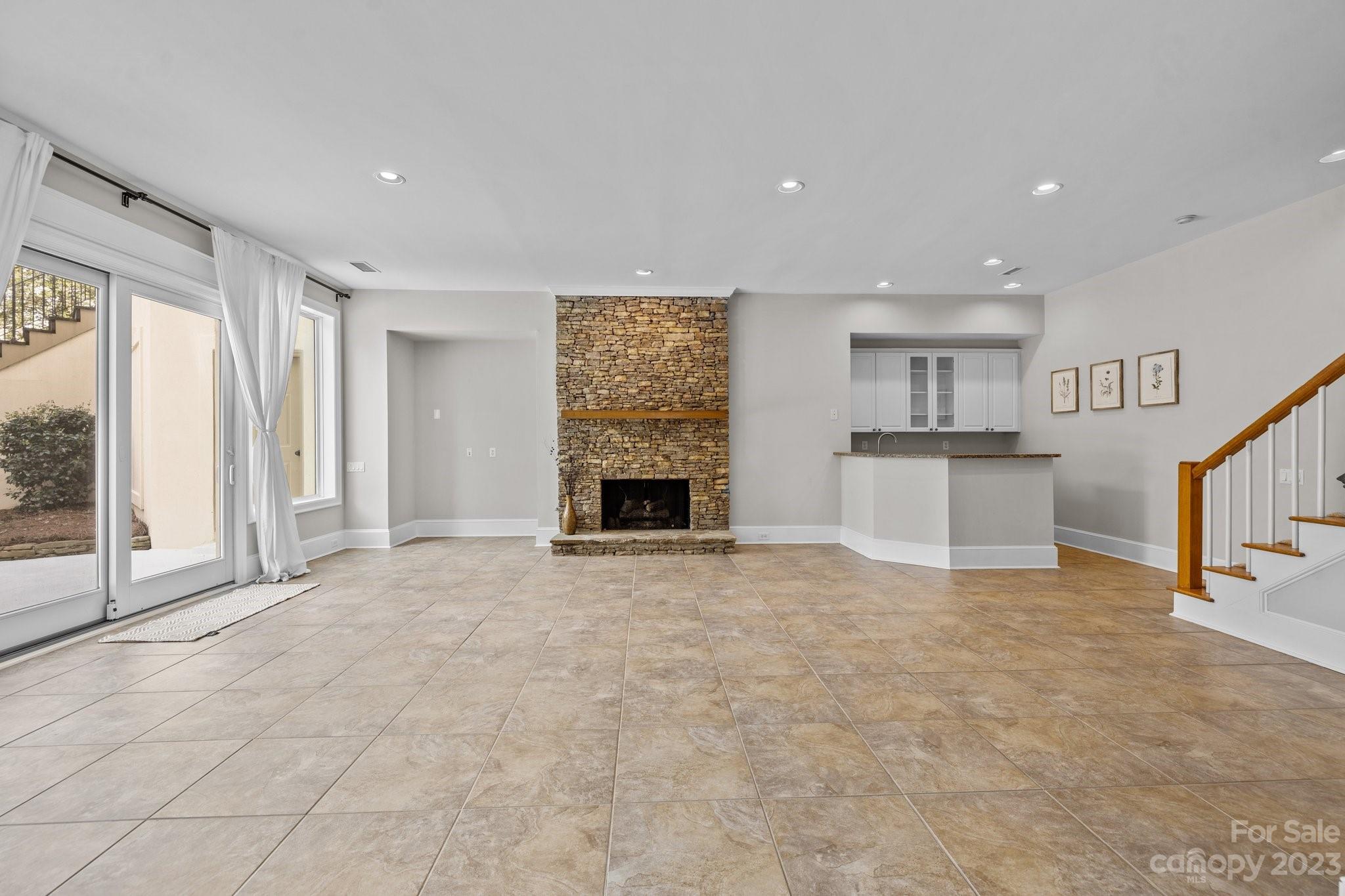 4732 Old Course Drive Charlotte, NC 28277 - Photo 38 of 48 a view of empty room with a fireplace and windows