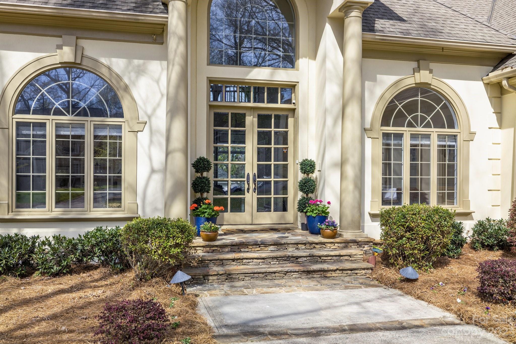 4732 Old Course Drive Charlotte, NC 28277 - Photo 7 of 48 a front view of a house with a garden