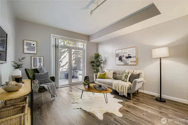 a living room with furniture and a large window