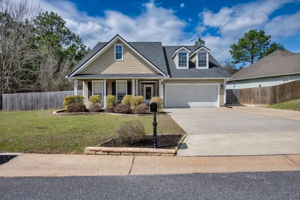 front view of a house with a yard