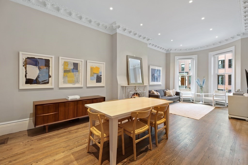 a large kitchen with a table and chairs in it