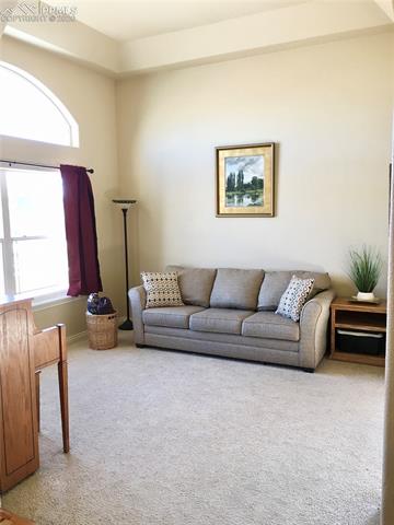 9275 Rockingham Drive Peyton, CO 80831 - Photo 6 of 26 Formal Living Room- perfect spot for Christmas tree!